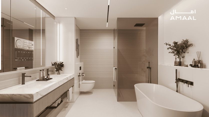 Une salle de bain luxueuse et moderne dotée d'une grande baignoire autoportante et d'une double vasque Amaal 8 avec comptoirs en marbre et lavabos rectangulaires. L'espace comprend une douche vitrée, une décoration minimaliste et un affichage numérique élégamment intégré au miroir.