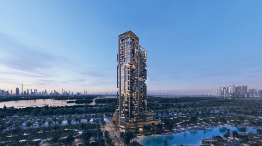 The Highgrove, a modern, high-rise skyscraper, stands amid palm trees and a serene body of water at dusk. It adorns the city skyline in the background, under a clear blue sky.