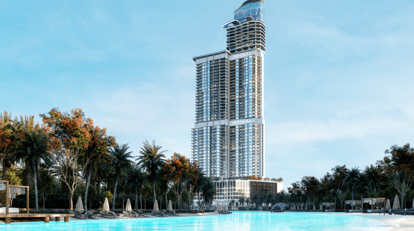 L'Amaal 8 se présente comme un gratte-ciel moderne et haut, avec de grandes baies vitrées scintillantes sur un ciel bleu vif. En contrebas, une grande piscine entourée de palmiers et de chaises longues crée une atmosphère de complexe hôtelier.