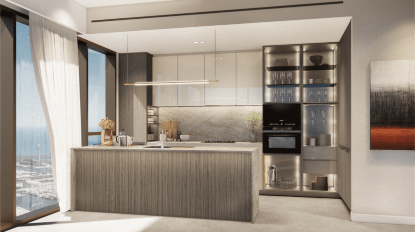 La cuisine moderne de Bay Grove Residences comprend un grand îlot, des appareils électroménagers intégrés et des armoires en verre présentant de la verrerie exquise. Des tons neutres et une décoration minimaliste créent un espace élégant et épuré, complété par une vue panoramique sur le port serein.