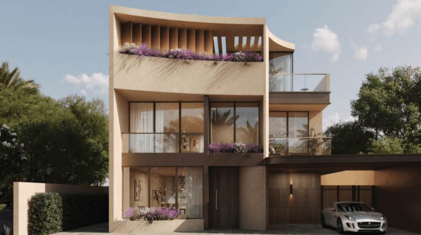 Une maison moderne de trois étages près de Kensington Gardens arbore une façade incurvée et de grandes baies vitrées. Les étages supérieurs sont dotés de balcons ornés de plantes violettes. Une voiture élégante repose sous le carport, tandis que des arbres verts luxuriants entourent la maison sous le ciel bleu clair de Londres.