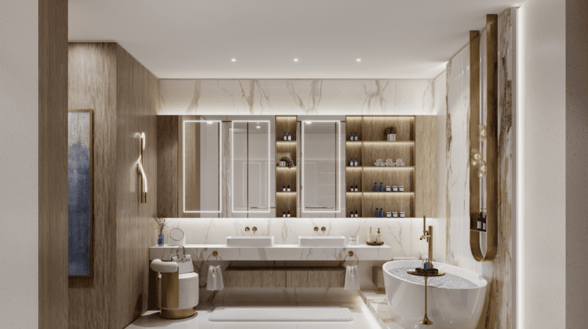 Salle de bains luxueuse aux murs et sols en marbre, rappelant l'élégance de Sunset Bay, avec baignoire autoportante, double vasque et grands miroirs. Des étagères encastrées présentent la décoration et les produits de toilette. Un éclairage chaleureux rehausse l'ambiance raffinée.