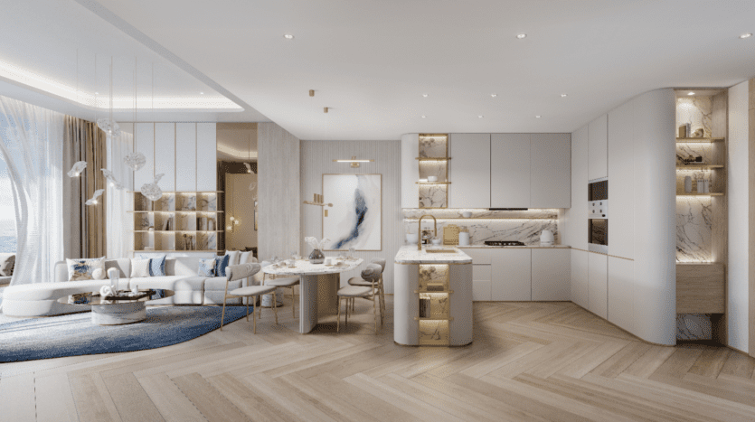 Le Beach Walk Grand propose un espace de vie et de cuisine moderne et luxueux avec parquet à chevrons, des touches de blanc et d'or, un canapé incurvé, des surfaces en marbre et de grandes fenêtres. Les luminaires suspendus ajoutent de l'élégance, tandis que l'art et la décoration rehaussent l'ambiance sophistiquée.
