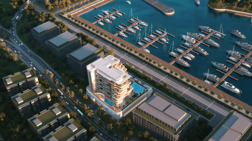 Vue aérienne de la Maison Cotier dans un quartier riverain, mettant en valeur son architecture moderne avec une piscine sur le toit nichée au milieu d'une végétation luxuriante. À proximité, une marina regorge de yachts le long du quai, tandis que des rues bordées d'arbres s'étendent parallèlement au rivage serein.