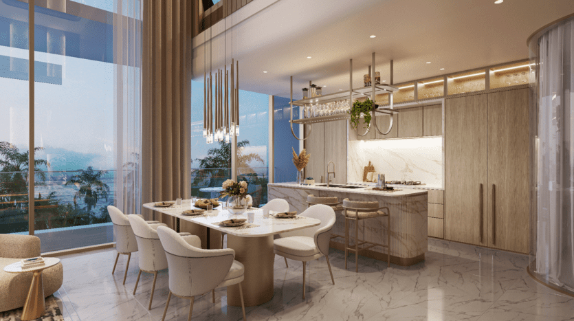 Coin repas et cuisine moderne avec sols en marbre et table élégante pour six personnes. Une grande fenêtre offre une vue sur les palmiers et l'océan. Un éclairage contemporain et des meubles élégants créent une atmosphère luxueuse.