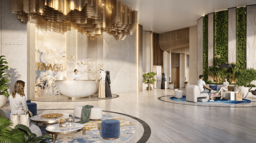 Le hall d'entrée de l'hôtel Rivage, au design moderne et luxueux, propose à ses clients un espace de réception élégant avec un bureau rond. L'espace dispose d'une élégante installation au plafond, d'un jardin vertical et de sièges confortables sur un sol en marbre.