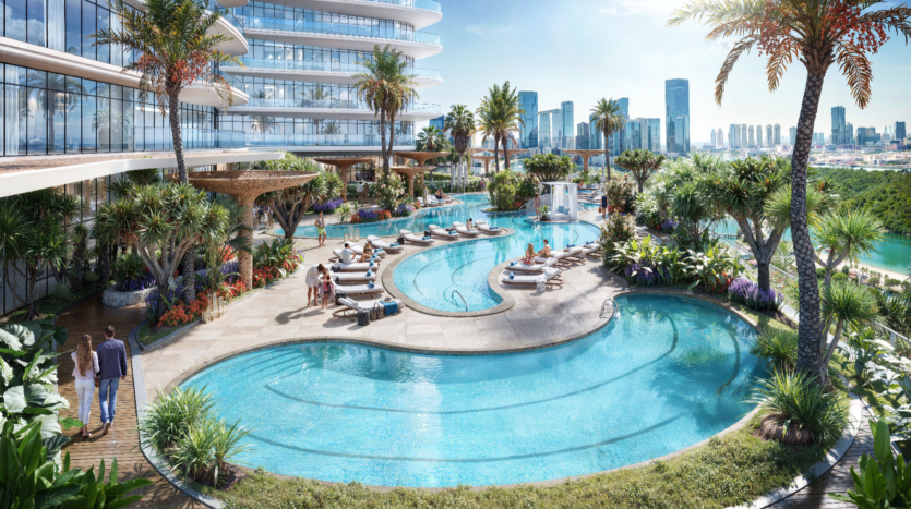 Découvrez l'élégance du Rivage, où un luxueux espace piscines du complexe hôtelier comprend des bassins sinueux et interconnectés encadrés par des palmiers et une végétation luxuriante. Détendez-vous sur les chaises longues le long de la terrasse tout en profitant d'une vue sur les toits de la ville moderne sur fond de ciel bleu clair.
