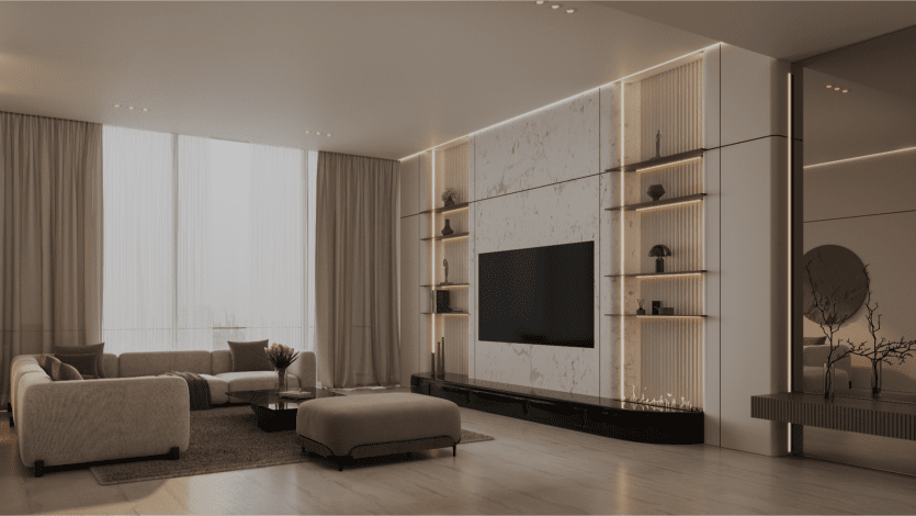 Un salon moderne et minimaliste de style Binghatti Elite dispose d'une grande télévision montée sur un mur d'accent en marbre, flanquée d'étagères intégrées. Des canapés aux tons neutres et une table basse reposent sur un tapis clair, tandis que de grandes fenêtres avec des rideaux transparents illuminent l'espace.