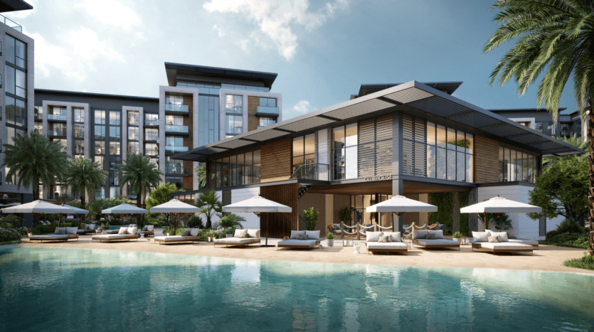 Un complexe hôtelier de luxe moderne avec vue sur la piscine. La scène comprend une piscine bleu clair, des transats avec des parasols blancs et un élégant bâtiment de deux étages avec de grandes baies vitrées. Des palmiers sont disséminés dans toute la zone et le ciel est partiellement nuageux.