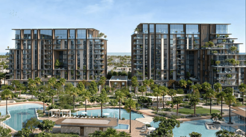 Vue de deux immeubles d'appartements modernes à plusieurs étages à Crestlane, entourés d'une végétation luxuriante. Au premier plan, il y a une grande piscine avec des palmiers et des chaises longues. Le ciel bleu clair laisse présager une journée ensoleillée parfaite pour une promenade en ville à proximité..
