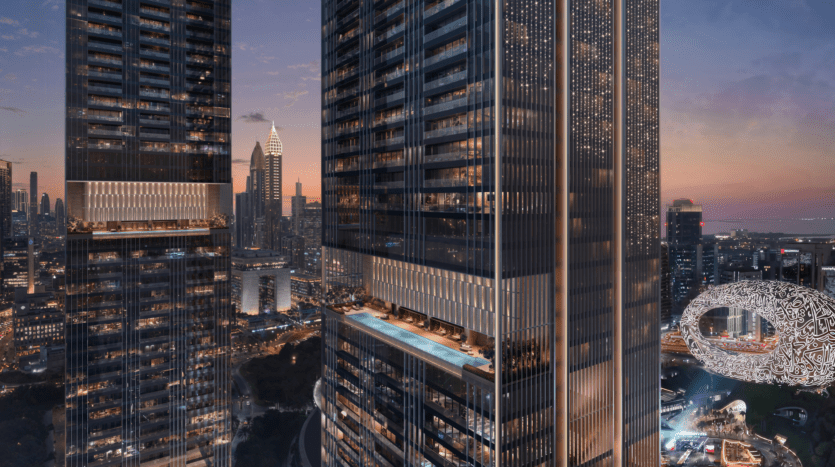 Two modern skyscrapers with illuminated windows, an outdoor pool and a half-height terrace overlook a twilight cityscape. The Museum of the Future and other skyscrapers can be seen in the background.