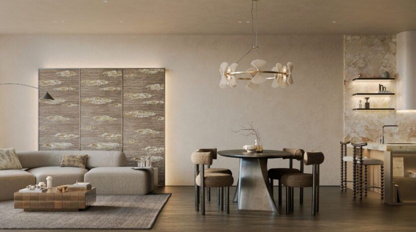 Salon et salle à manger modernes dans les résidences Cheval avec un canapé sectionnel beige, des panneaux muraux texturés, une table ronde avec quatre chaises, un lustre unique, un décor minimaliste et des étagères encastrées dans une palette de couleurs neutres.