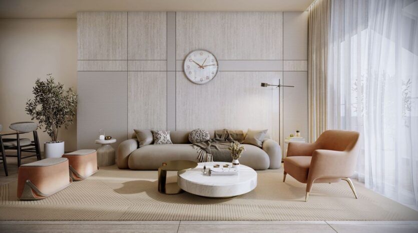 Un salon moderne à Derby Heights dans des tons neutres, avec un grand canapé beige, un fauteuil rose, une table basse ronde blanche, une horloge murale, un lampadaire et de grandes fenêtres avec des rideaux transparents qui laissent entrer la lumière naturelle.