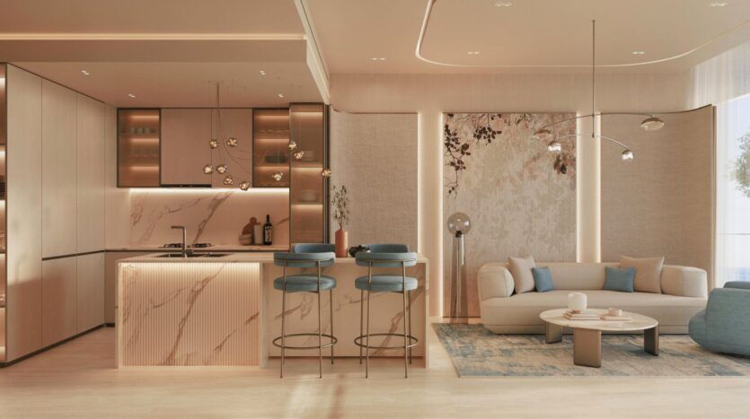 Cuisine et salon modernes, agrémentés de touches de marbre, de murs beiges, de tabourets de bar rembourrés bleus, d’un canapé incurvé, d’une table basse ronde et d’un mur d’accent à motifs floraux : cet espace inspiré de Vue Dorée se distingue par un éclairage chaleureux et une décoration élégante et minimaliste.