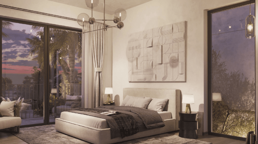 A modern room in a Dubai villa featuring a king-size bed with neutral bedding, abstract artwork on the wall, contemporary lighting and a panoramic view of palm trees through sliding glass doors at dusk.