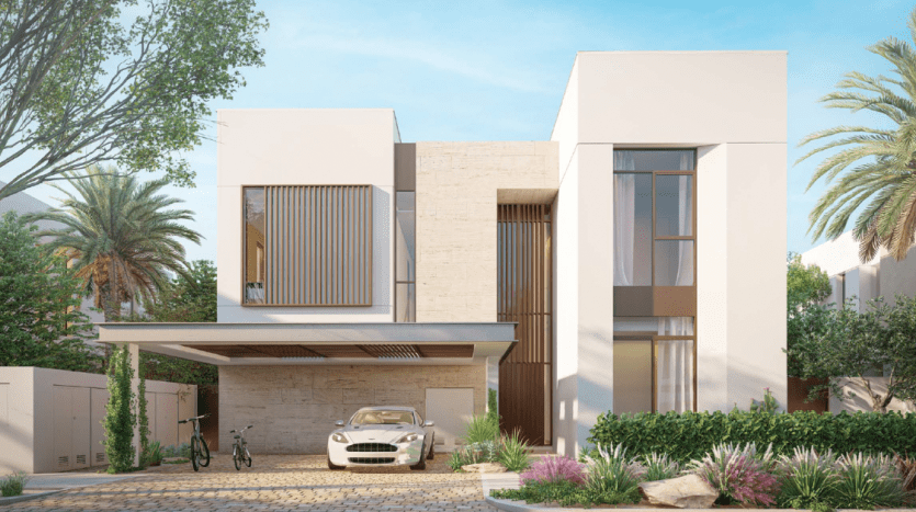 Modern two-storey house with flat roof, clean lines and large windows. A white car and bicycle are parked out front, surrounded by lush gardens and palm trees. Ideal for an investment in