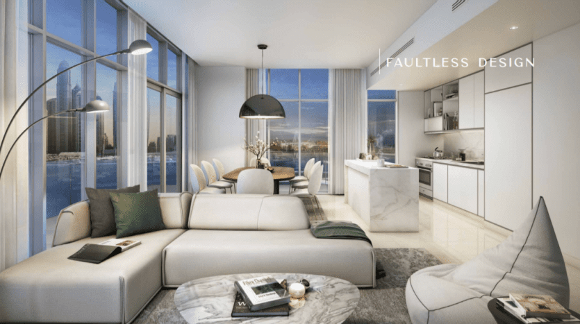 Salon moderne avec un canapé, un fauteuil et un coin repas aux tons neutres. De grandes fenêtres mettent en valeur les toits de la ville au crépuscule. L'espace présente une connexion transparente avec une cuisine élégante dans cette résidence de palais