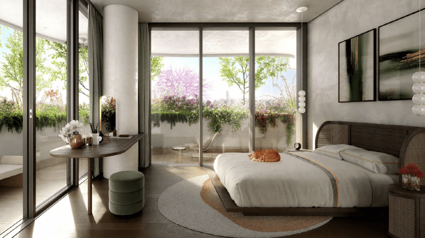A serene room in a Dubai villa with a modern, natural design featuring a king-size bed, desk, picture windows overlooking the cityscape and vibrant trees in bloom outside. The decor