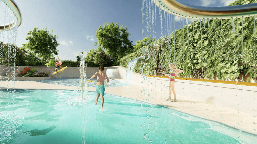 Children play in a lively outdoor pool in a luxurious Dubai villa, surrounded by lush greenery and cascading, sun-drenched waterfalls.