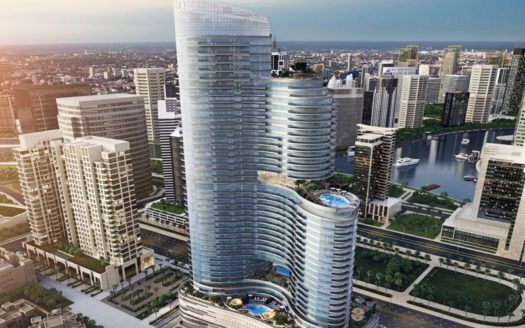 La representación artística del complejo de rascacielos Imperial Avenue presenta un diseño moderno y curvilíneo con varias torres que dan a un río en una zona urbana densamente poblada. El diseño presenta ondas