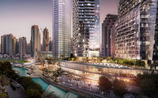 Una animada escena urbana junto al agua al atardecer, con modernos rascacielos, incluido el Address Residences Dubai Opera, un paseo peatonal y un canal iluminado por las farolas y las luces de los edificios.