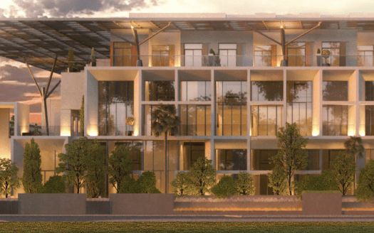 Moderno edificio de apartamentos en Dubai al atardecer con balcones acristalados, rodeado de jardines y árboles. La suave luz del sol resalta el diseño elegante y contemporáneo del edificio.