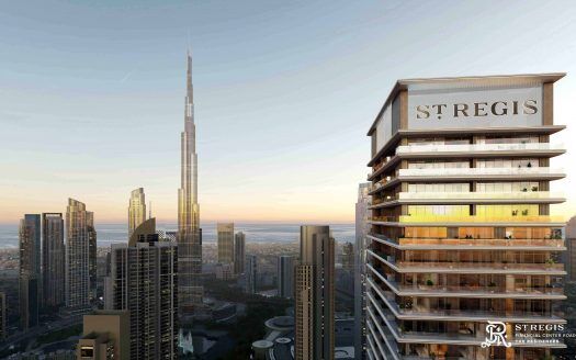 Vista aérea de un paisaje urbano al atardecer, con el Hotel St. Regis en primer plano y el imponente Burj Khalifa al fondo, bajo un cielo despejado con destacados edificios de apartamentos de Dubai.
