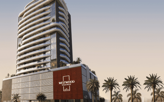 Un moderno rascacielos de diseño curvo, denominado "Westwood Grande", rodeado de palmeras y con un cielo crepuscular como telón de fondo, ocupa un lugar destacado en la cartera de una agencia inmobiliaria de Dubai.