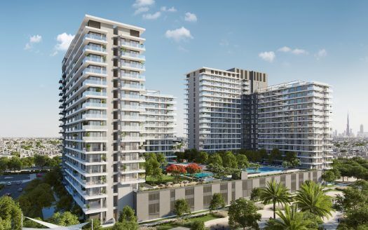 Un moderno complejo residencial compuesto por varios rascacielos rodeados de exuberante vegetación y cuidados jardines, con un cielo despejado en lo alto y los tejados de la ciudad de Dubai al fondo.