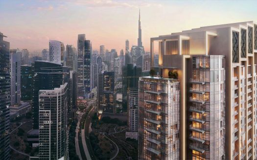Una vista del paisaje urbano al atardecer con modernos rascacielos con un edificio destacado iluminado con luz dorada en primer plano, posicionado como una oportunidad de inversión ideal en Dubai. El cielo está pintado en tonos rosas y azules