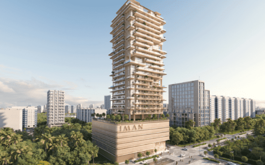 Un moderno rascacielos llamado "AMAN" se alza orgulloso contra un cielo despejado. Tiene varios balcones y está rodeado por el vibrante paisaje de One Park Square, con otros edificios, vegetación y concurridas calles de la ciudad que realzan el paisaje.