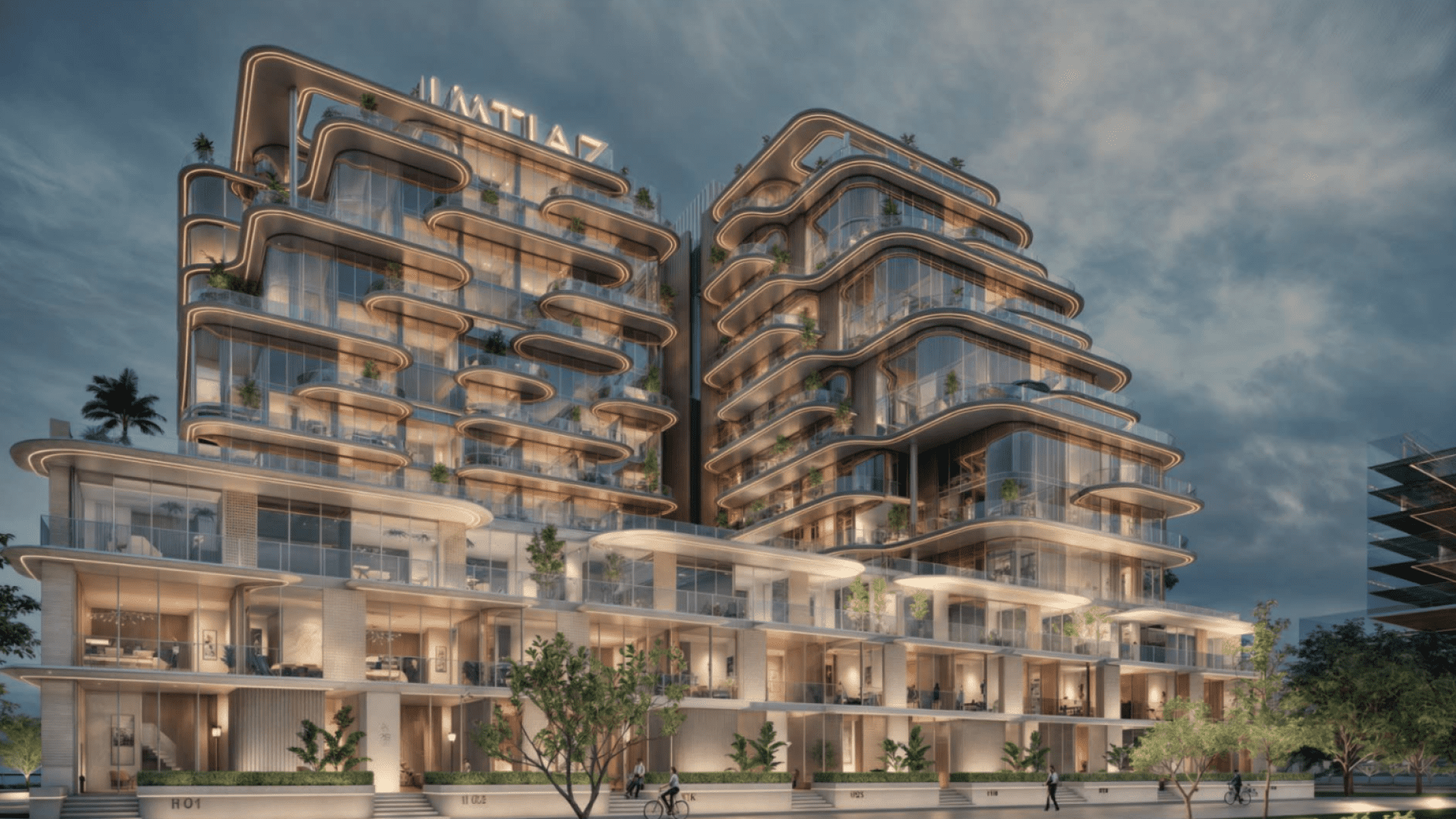 La Maison Cotier es un edificio moderno de arquitectura elegante y curvilínea, bellamente iluminado al atardecer. La estructura tiene varias plantas con grandes ventanales y balcones, todo ello enclavado en un entorno verde. Su nombre corona con orgullo la cima de esta maravilla arquitectónica.