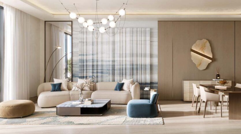 Un salon moderne et élégant, décliné dans des tons neutres, comprend un canapé crème, des sièges bleus et beiges, une table basse, un lustre raffiné, des œuvres d'art abstraites accrochées aux murs, ainsi qu'un coin repas avec une table et des chaises en bois, reflétant ainsi le style raffiné de Binghatti Wraith.