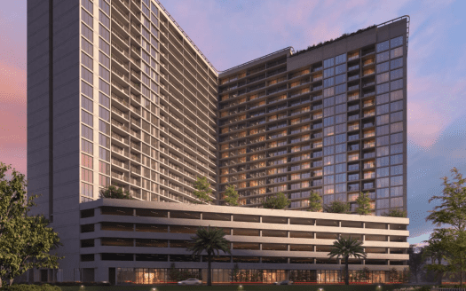 Immeubles jumeaux modernes de grande hauteur dotés de vastes façades vitrées et d'un parking attenant à plusieurs niveaux, le tout sur fond de ciel vibrant au coucher du soleil. Verdure luxuriante et vue au niveau de la rue visible à Dubaï.
