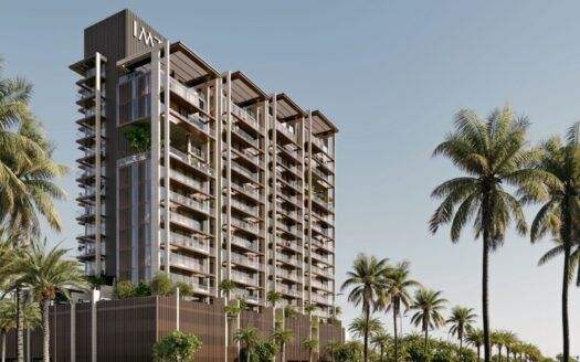Un immeuble moderne de plusieurs étages avec de grands balcons et des façades en verre se dresse à Sea Cliff, entouré de grands palmiers sous un ciel bleu limpide.