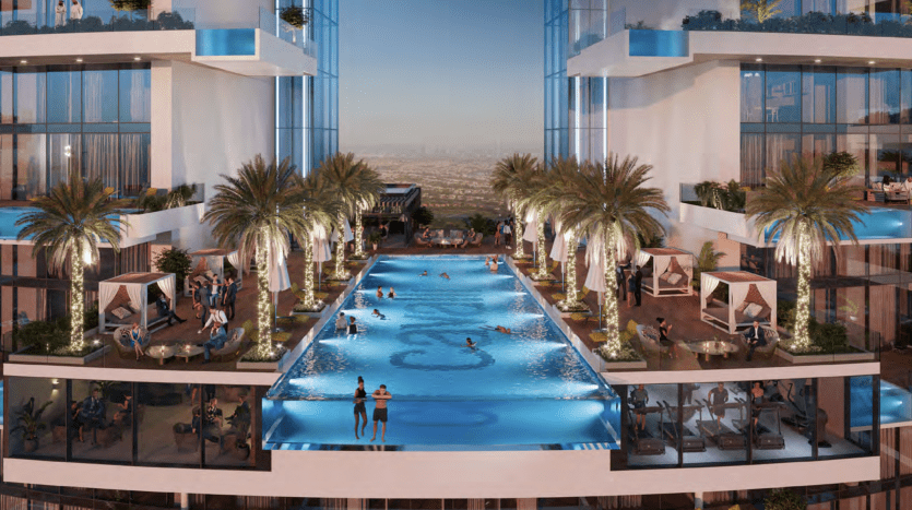 A luxurious rooftop pool at dusk, surrounded by palm trees and the modern Roberto Cavalli glass tower in Dubai, with people relaxing and swimming.