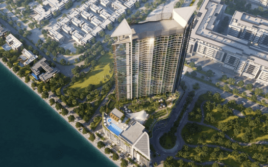 Veduta aerea di un moderno grattacielo, Waves Grande, con un tetto a forma di ala unico nel suo genere, circondato da un parco verde e situato accanto a uno specchio d'acqua, con altri edifici urbani nella zona.