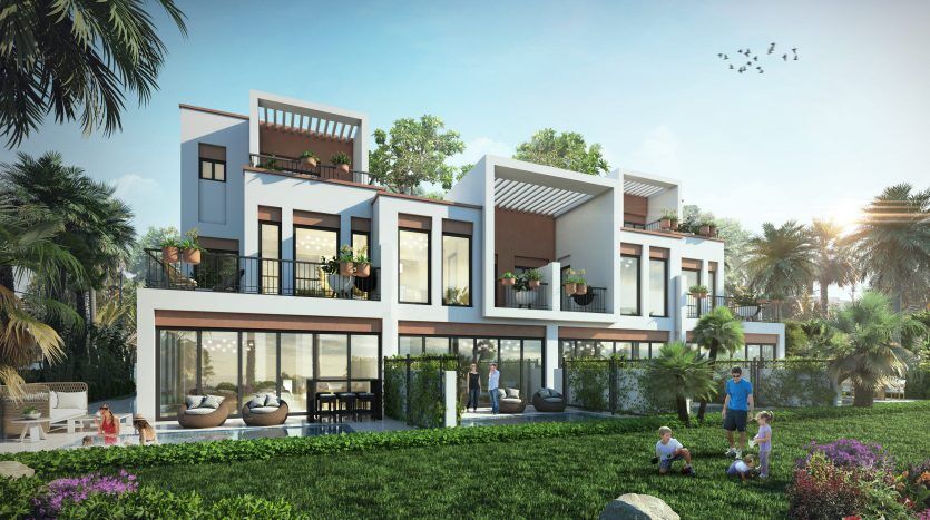 Bâtiment résidentiel moderne de plusieurs étages et blanc avec de grandes fenêtres dans les lagons de Damac sur la Costa Brava, entouré de jardins luxuriants et de palmiers, avec une famille profitant du plein air au premier plan.