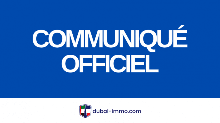 A bold blue background displaying the text "official press release" in large white letters, with the Dubai Immo logo in the bottom right-hand corner.
