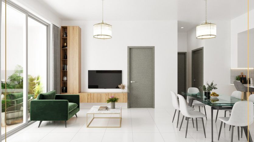 Un salon moderne et élégant dans un appartement à Dubaï avec des murs blancs et une grande fenêtre. Il comprend un canapé vert, une bibliothèque en bois, une table à manger blanche avec des chaises et des lampes suspendues.
