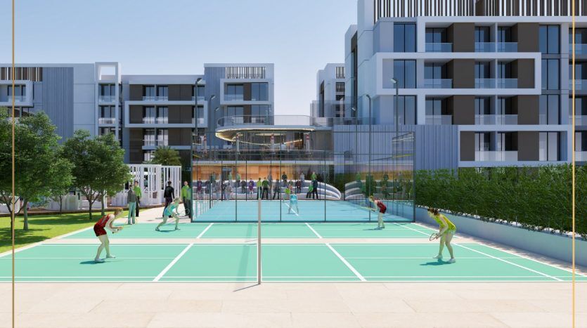 Rendu architectural d'un complexe résidentiel moderne à Dubaï comprenant un court de tennis extérieur avec des gens jouant, entouré de bâtiments contemporains à plusieurs étages et d'espaces verts.