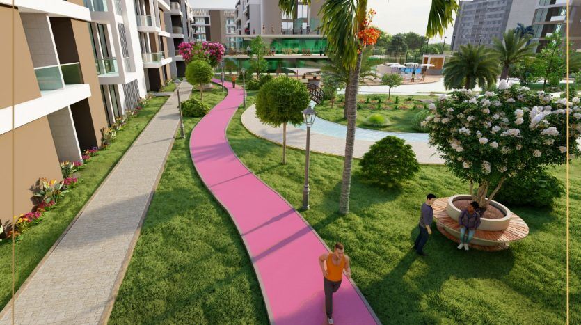 Un rendu architectural 3D vibrant d'un quartier résidentiel de Dubaï avec un sentier pédestre rose, une verdure luxuriante, des appartements modernes et deux personnes se promenant avec désinvolture.