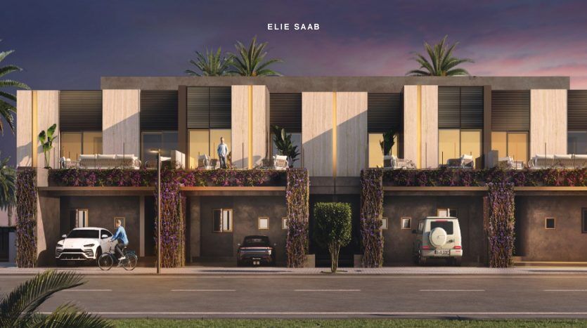 Rangée de maisons de ville modernes au crépuscule avec plantes décoratives et éclairage d'ambiance. Chaque maison dispose de balcons et de véhicules garés : une voiture blanche, une voiture noire et un vélo. Logo Elie Saab