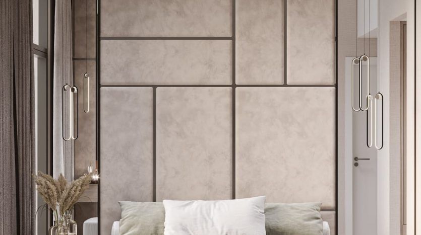 Une chambre moderne dans une villa de Dubaï comprenant un grand lit avec des draps blancs et un jeté vert, flanqué de tables de nuit en bois et de grands panneaux de tête de lit rembourrés, sous un éclairage tamisé.