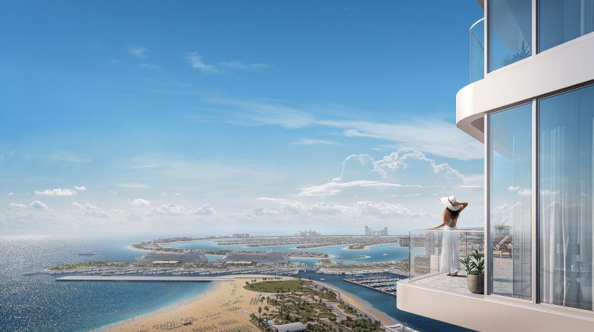 A woman wearing a sun hat stands on the high balcony of a Dubai villa, overlooking a picturesque coastal cityscape with beaches, a blue ocean and a clear sky.