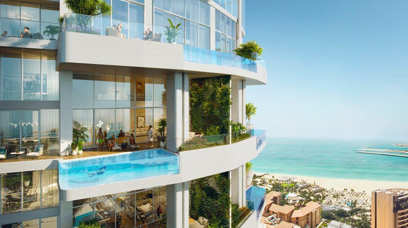 A luxurious high-rise building featuring modern apartments with large balconies, glass balustrades and lush greenery. Each balcony has a private pool overlooking a picturesque beach, perfect for those looking for an exceptional apartment.