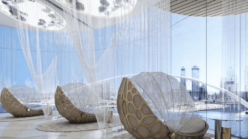 Modern interior of an office lounge in Dubai with bean bag chairs, sheer curtains, panoramic views of the cityscape and elegant ceiling lights.