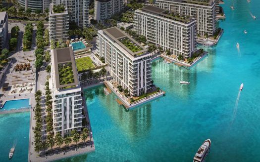 Vista aerea di un lussuoso complesso balneare di Dubai, con moderni grattacieli circondati da un'acqua turchese vibrante, con verde lussureggiante, piscine e barche che navigano nelle vicinanze.