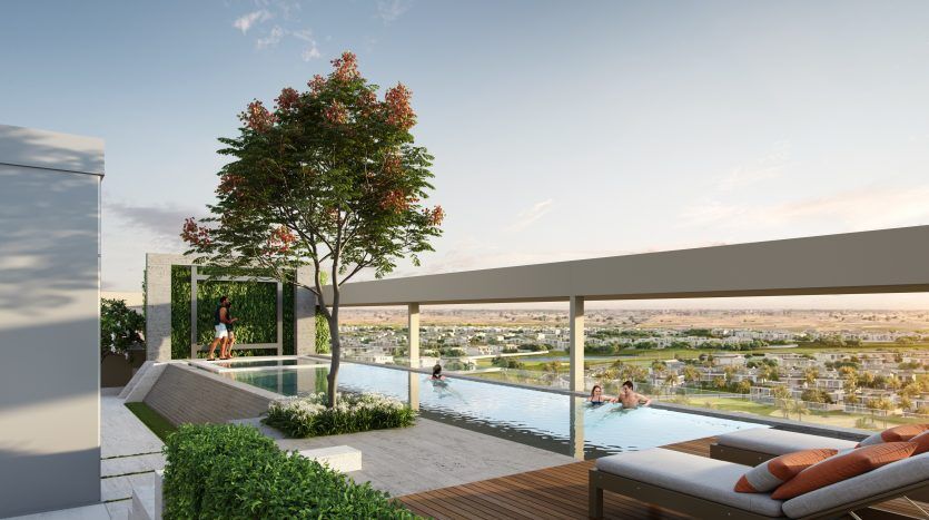Luxurious rooftop terrace in a Dubai villa with an infinity pool overlooking a picturesque expanse, furnished with modern sun loungers and surrounded by lush greenery and a vibrant tree. People enjoy the relaxing environment