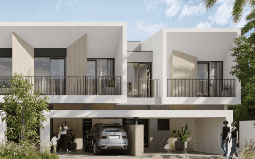 Bâtiments résidentiels modernes à Dubaï au design cubique, dotés de grandes fenêtres et de balcons. Les gens passent et interagissent à proximité de voitures garées et d’une verdure luxuriante.